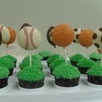 Sports Cupcakes I made these cupcakes for my son's birthday. I used the grass tip for the cupcakes and made candy lollipops.