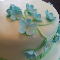 Anniversary Cake Cake covered with MMF and gum paste flowers.