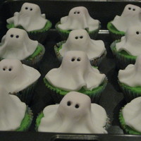 Ghost Cupcakes Fondant ghost with marshmallow underneath, made for my daughter's kinder Halloween party. They were a hit!