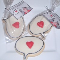 Rjs V Day Cookies Vanilla bean sugar cookies made with a hand made cutter. Topped with royal icing and a cast red chocolate heart dusted with super pearl....