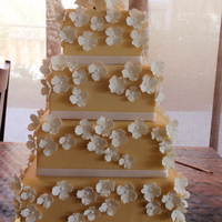 Hydrangea Cake 6,8,10 and 12 inch square cake. Color should be ivory but it turned out more of a peach color. 6 and 8 are lighter than the 10 and 12. I...