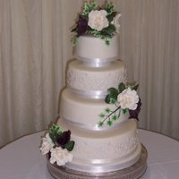 Cream Rose And Black Calla Wedding Cake Four tier wedding cake (2 tiers rich fruit, 2 lemon sponge) with handmade sugar flowers and leaves