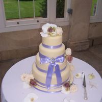 Vintage Brooch Wedding Cake I made this cake for a friend's wedding last year. Four tiers of chocolate truffle torte covered in white modelling chocolate and...