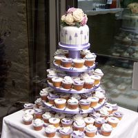 Lavender, Sugar Rose And Butterfly Cupcakes Vanilla, lemon and lavender scented flavour cupcakes topped with piped laveder, gumpaste roses and hand made sugar butterflies.The stand is...