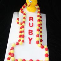 Big Bird & Elmo First Birthday This is all made from sugar modelling paste, I did big birds in the modelling paste and then covered it with little circles of yellow royal...