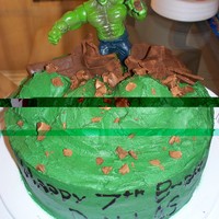 Hulk Cake Terrible photo, sorry! All done in buttercream icing. Hulk is an action figure. This was such a fun cake and my son loved it!