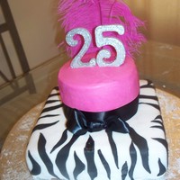 Twins Birthday Cake top tier is buttcream icing, and bottom tier is all fondant covered.