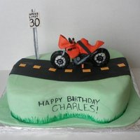 Buell Motorcycle Cake Motorcylcle and speed limit sign are gumpaste.