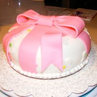 1St Fondant Cake - Wilton Course 3 The cake in the book was square, but I made it round. Also, it is smaller than an 8 in, so that my huband (who is diabetic) can have a...