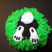 Underground Bunny Buttercream grass with Oreo cookie crumbs. Bunny is fondant. really fun to make.