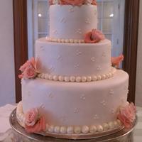 Fresh Flowers Basic design, swiss dots on ivory fondant with fresh flowers. Understated elegance!!