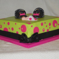 Mary Jane's And Baby Done for a baby shower for a friend and the baby's room is pink and green, and black. Buttercream with fondant deco and 50/50 shoes.