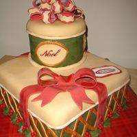 Stacked Christmas Gifts! 12 inch square (choc. with chocolate-mint butter cream) and 6 inch round (vanilla cake with orange cranberry mousse) stacked and decorated...
