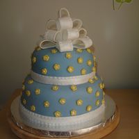 Nov_2008_120.jpg My first stacked cake. It was for my son's preschool teacher and her favorite color is blue. The yellow flowers help the cake look...