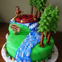 River Rafting Theme Cake The raft and man were modeled out of fondant. The river was marbled fondant that was then drizzled with thinned royal icing. The trees were...