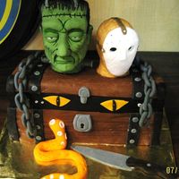 Halloween Frankenstein & Jason All edible! Heads made of rice krispy treats w/fondant. Chain, lock, knife etc. made from fondant. Chest is cake covered with fondant!