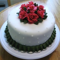 9" Layered Cake Covered In Fondant And Fondant Flowers 9" layered cake covered in fondant and fondant flowers.