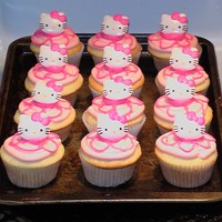 Hello Kitty Cupcakes I made a flower on top and stuck hello kitty rings on top