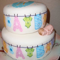 Baby Shower Cake Vanilla cake covered with fondant and decorated with edible images.