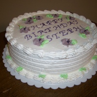 Drop Flower Birthday Cake White drop flower birthday cake with colored piping gel message with edging tool used and shell border.