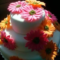 Gerbera Daisy Wedding Cake I made this for a friend of mine who was married over the week-end. This is a three tiered white cake with french vanilla custard filling....