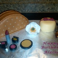 Cosmetics Bag & Makeup the cosmetics bag and gift box are snickerdoodle cake with cream cheese frosting and vanilla fondant; the make up pieces are all fondant...