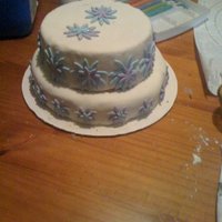 Anniversary Cake :) I made this anniversary cake f or some dear friends of my husband and I . Its a carrot cake with creamcheese frosting . Covered in fondant...