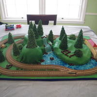 2Nd Bday Thomas the train party. Track around the outside had thomas the train cars that actually ran aroiund the cake.
