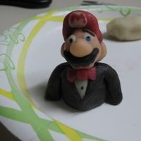 Marzipan Mario This was for a groom's cake (my first cake ever) that we made for a friend's wedding..He's made entirely of marzipan that I...