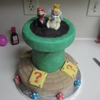 Super Mario Groom's Cake This cake was my very first cake. It was for a friend's small wedding. The cake itself is a two layer cherry chip cake covered in...