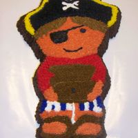 Pirate I just recently began the Wilton Course 1. This is my practice cake. Not bad for having a 2 year old in my lap while decorating. :)