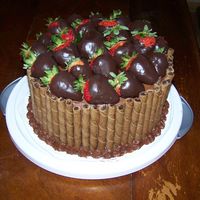 Chocolate Cake With Strawberries I made this cake for my husbands 30th birthday. He loves cheesecake, chocolate, and strawberries. It has two layers of yellow pudding cake...