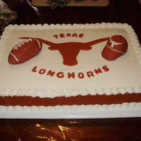 Texas Longhorn's Cake My mom made this UT cake. The football and the cap are rice crispy treats molded and covered with fondant. I think she did a wonderful job...