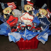 Patriotic Cookie Bouquet My mother made this cookie bouquet. The man that it was made for is a motorcycle lover. Tomorrow is his birthday. They are sugar cookies...
