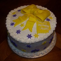 Yellow And Purple Birthday Cake With A Bow I made this cake for a customer. It is a three layer, 9" round, filled with cherry filling. The icing is buttercream and the...