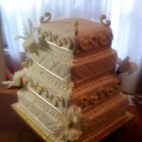 Wedding Cake this was my very first wedding cake...i used royal frosting for the c scrolls, the flowers and ribbon are not edible..the person who...