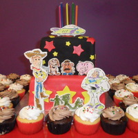 Toy Story Cake 2 tier white cake with strawberry banana filling. Red & Black Satin Ice fondant used. Little figures are made of fondant and Buzz &amp...