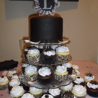 Mini Cake & Cupcakes Basic Black 6 inch cake (vanilla cake with vanilla butter cream) and 4 dozen assorted cupcakes. I like the way it all came together. My...