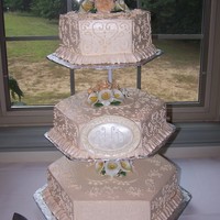 Hearts And Lace The three hexagon tiers are done in Ivory Swiss Meringue Buttercream (which is NOT a easy frosting to decorate in). There are gum paste...