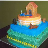 Dog Theme Birthday Cake This was my son's first birthday cake. I made the dogs out of fondant and the dog house out of graham crackers. I even added dog poop...