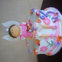 Anna's Fairy Princess 12" w/ 12" fairy. Fondant and gumpaste figure, gumpaste flowers and fondant 2-Ds.