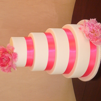 Pink Peony 12-10-8-6 classic stack with satin ribbon and silk peonies.