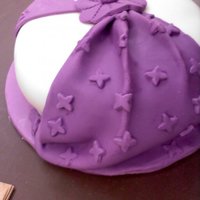 Fondant & Gumpaste Class#2 We were learning the drapping and hankerchief techniques....on the same cake. It looks a little silly, but I liked the drapped side.