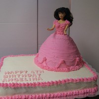 Birthday Girl Cake Cake is done with all buttercream. The doll part is made using the Wilton's doll pan.
