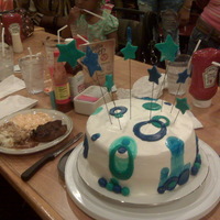 My First Decorated Cake!! This was first attempt at decorating a cake. It's a white cake with fresh strawberry filling and whipped vanilla cream cheese frosting...