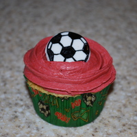 Soccer Cupcakes golden butter cupcakes with buttercream and fondant soccer ball for my daughter's end of season party. Red is their team color.