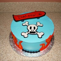 Skateboard Cake 2 10 inch rounds iced in buttercream, fondant accents, skateboard is gumpaste