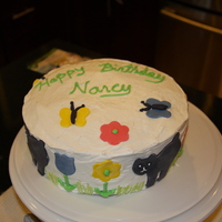 Cat Birthday Cake Made this for my friend. Vanilla butter cream with fondant cats and flowers. Used edible easter grass to decorate (not very tasty).