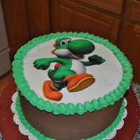 Yoshi My son was in to mario amd wanted a Yoshoi cake. First to I'v ever used an icing sheet. Chocolate and white cake white bc