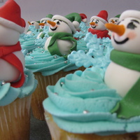 Snowmen And Snowflakes Snowmen made out of fondant and snowflakes made from RI.
